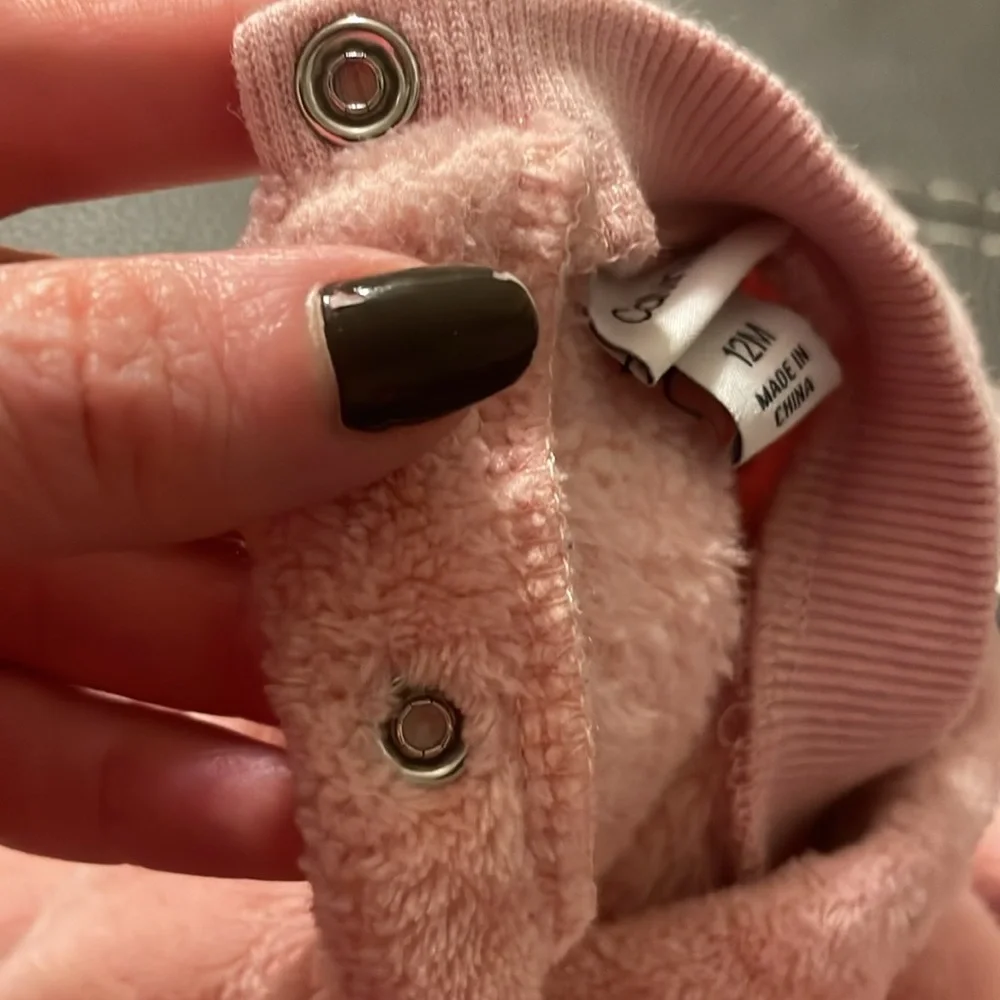 Calvin Klein size 12 months. Soft pink‎ two snap buttons behind neck. GUC.